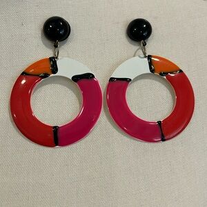 Pink, white, orange, and black pierced earrings